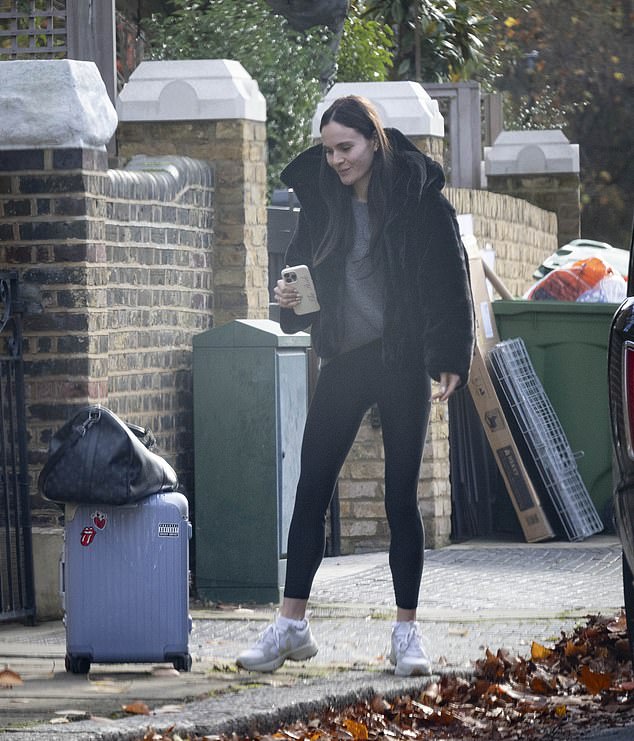 Holly was clutching a 'Bride' phone case when she broke cover on Thursday morning for the first time since her feud with fiancé Adam Peaty's family came to light