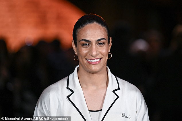 Olympic gender row boxer Khelif, pictured at Paris Fashion Week, put her faith in the legal process