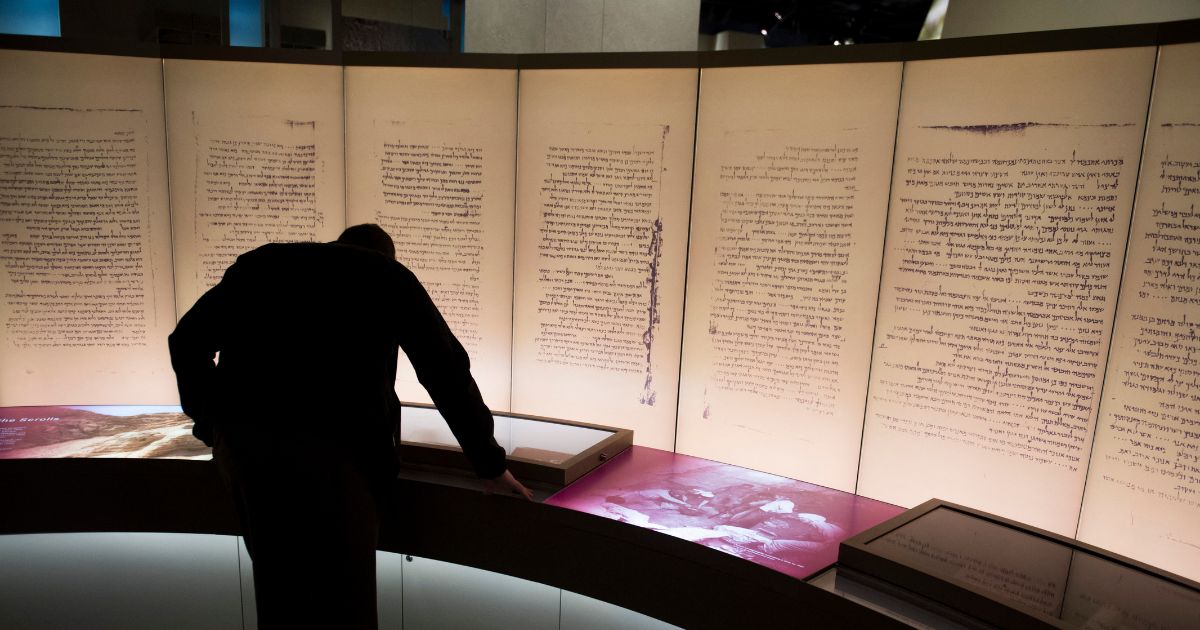 A visitor looks at an exhibit on the Dead Sea Scrolls at the Museum of the Bible in Washington, DC on Nov. 14, 2017.