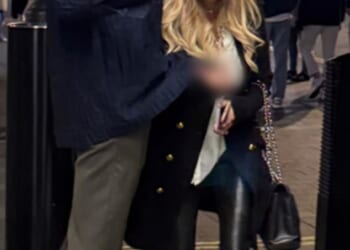 Police released this photo of two people they want to talk to after a family was allegedly racially abused and assaulted in central London (image blurred at source by British Transport Police)