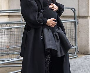 The expectant mother cradled her bump