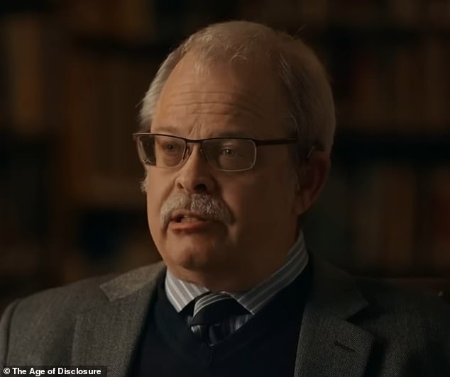 'One of them landed on the tarmac and a non-human entity de-boarded the craft that landed and interacted with uniformed Air Force and civilian CIA personnel,' Davis (pictured) recalled Bush saying