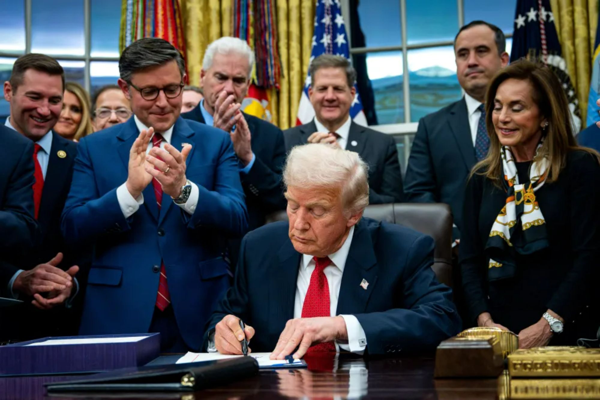 An image collage containing 1 images, Image 1 shows President Trump signing a funding package to reopen the federal government in the Oval Office