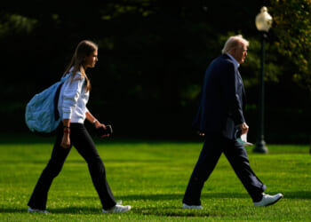 President Donald Trump, right, arrives with his granddaughter Kai Trump at the White House, Sept. 26.
