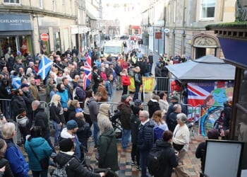 Locals gathered to protest in the city centre over the asylum plan