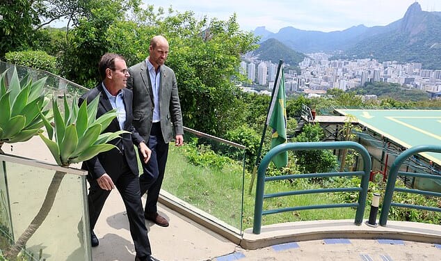 Mayor of Rio de Janeiro, Eduardo Paes speaks with Prince William, Prince of Wales on a visit to Sugarloaf Mountain during day one of his visit to Brazil