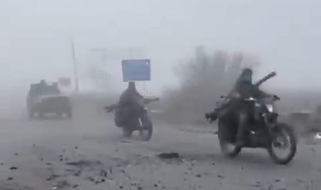 Haunting footage has emerged showing Russian troops advancing through thick fog in a convoy of wrecked cars, many missing doors and windows, in scenes likened to Mad Max