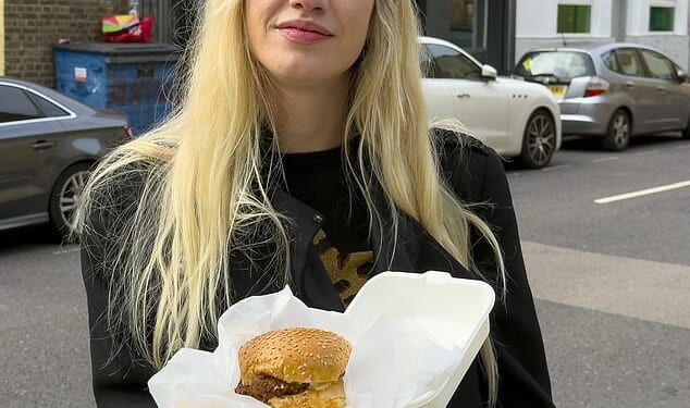Reporter Lydia Veljanovski with a Coqfighters chicken burger created at The Little Kebab House in Isle of Dogs, east London