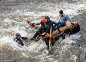 Audience members at the Boxing Day race in Matlock, Derbyshire, have been known to throw eggs and bags of flour during previous races with participants often returning fire with water pistols (Pictured: The Matlock Boxing Day Raft Race 2016)
