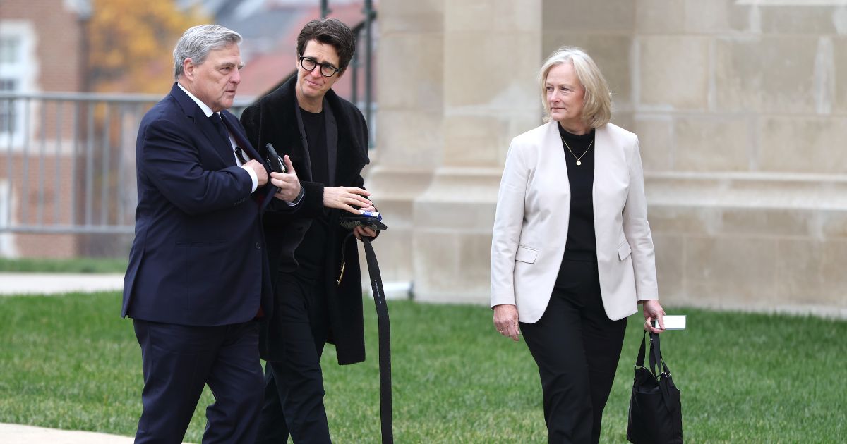 U.S. Army Gen. (Ret.) Mark Milley, political commentator Rachel Maddow, and Milley's wife Hollyanne Milley arrive for the funeral service for former Vice President Dick Cheney at the National Cathedral on Nov. 20, 2025, in Washington, D.C.