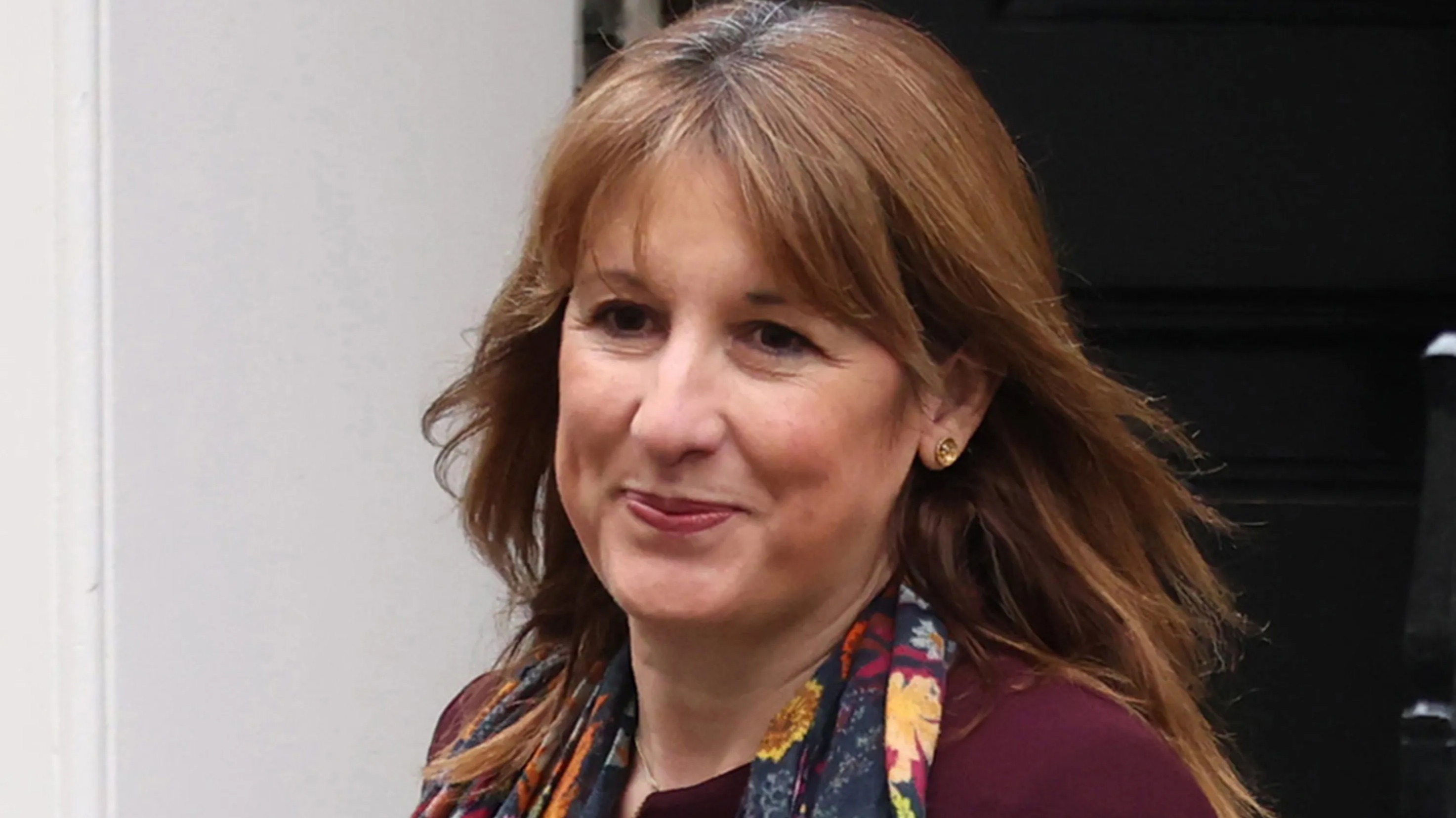 Rachel Reeves, Chancellor of the Exchequer, smiling as she leaves 11 Downing Street.