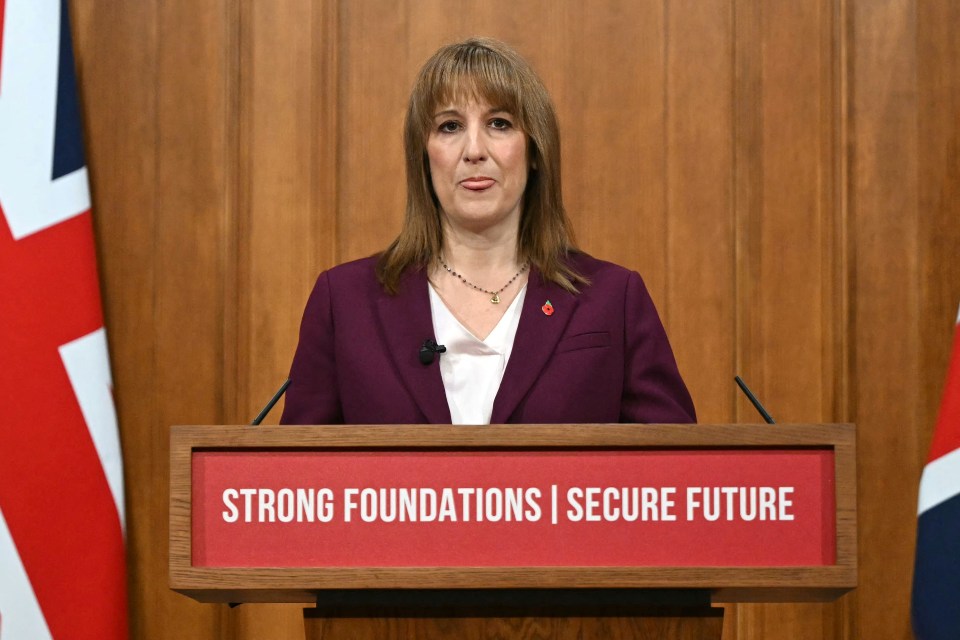 Rachel Reeves speaking at a podium with "Strong Foundations | Secure Future" on it.