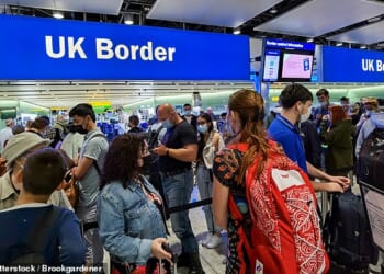 Passengers at the UK Border gates at Heathrow airport