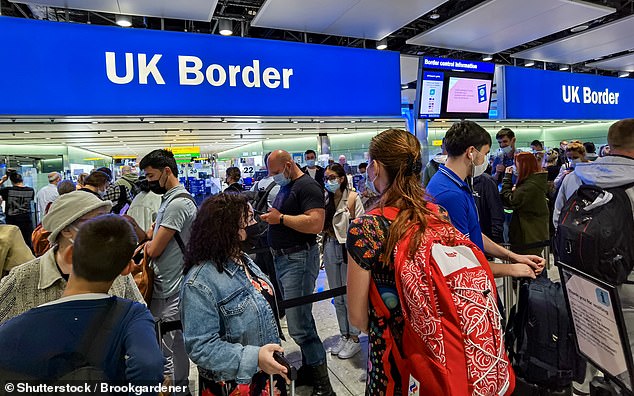 Passengers at the UK Border gates at Heathrow airport