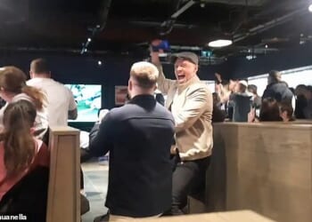 Republic of Ireland fans celebrate in Dublin Airport Sunday's dramatic 3-2 win at Hungary