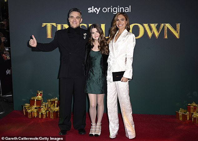 The singer, 51, and his glamorous actress wife, 46, proudly wrapped their arms around their 13-year-old daughter as she made her red carpet debut