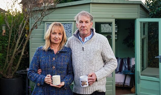Andrew and Julie Causley (pictured) have been ordered to take down his summerhouse in their garden in Exeter