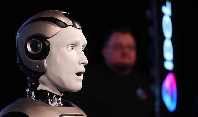 The bot, known as AIDOL, staggered out on stage triumphantly to the Rocky theme song in front of around 50 journalists before the machine shuffled to the left and waved to the audience