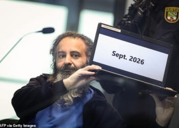 Taleb Jawad al-Abdulmohsen, a psychiatrist, is seen sitting behind a bullet-proof glass in court. He is accused of killing six people and injuring 300 when he drove into a crowd at a German Christmas market