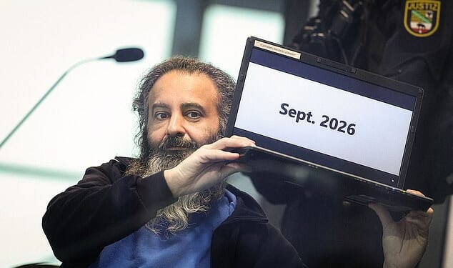 Taleb Jawad al-Abdulmohsen, a psychiatrist, is seen sitting behind a bullet-proof glass in court. He is accused of killing six people and injuring 300 when he drove into a crowd at a German Christmas market