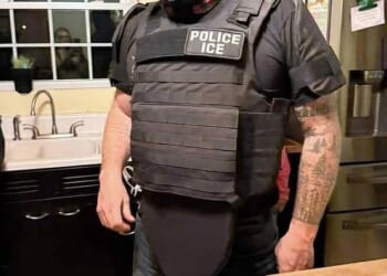 James Black, principal of a Maine middle school, was captured in a now-viral photo wearing an officer-style vest with a patch reading 'POLICE ICE' and a hat labeled 'ICE'