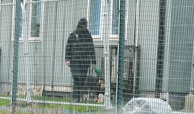 Guards with dogs were seen patrolling Crowborough Army Training Camp in East Sussex today