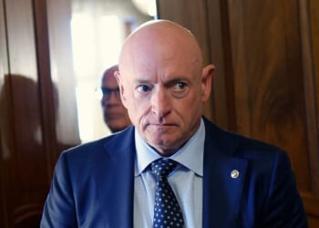 Sen. Mark Kelly leaves a Senate meeting in the US Capitol on Oct. 3, 2025 in Washington, DC.