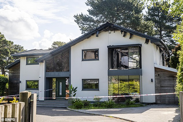 A £1.5m mansion is seen in ruins after being destroyed by a huge fire thought to have been started by newly installed solar panels