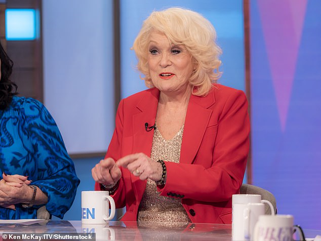 Sherrie Hewson has revealed she was once kicked under the table by her Loose Women co-star Coleen Nolan after making an 'outrageous' comment live on air (Sherrie pictured on the show 2024)