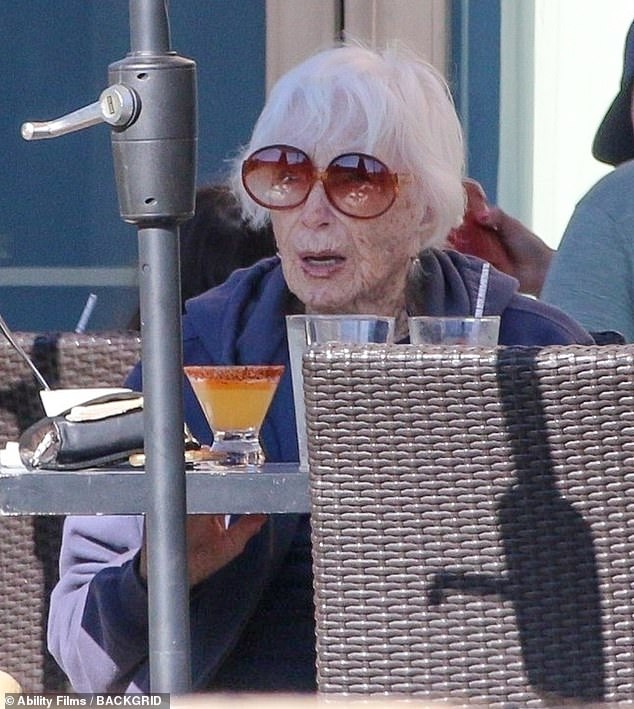 Shirley MacLaine, 91, sipped on a refreshing cocktail as she stepped out for a rare outing in Malibu on Tuesday