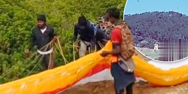 Shocking moment migrant tries to PARAGLIDE into Europe over fortified fence