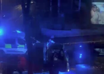 In the footage, filmed from a nearby window, a pickup truck can be seen driving down a residential street in Lewisham - in southeast London - as a police officer and a police van follow behind