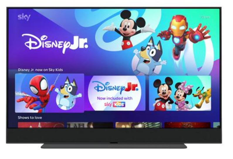 TV screen showing the Disney Jr. interface, including Mickey Mouse, Iron Man, Bluey, Spider-Man, Minnie Mouse, and Pluto.