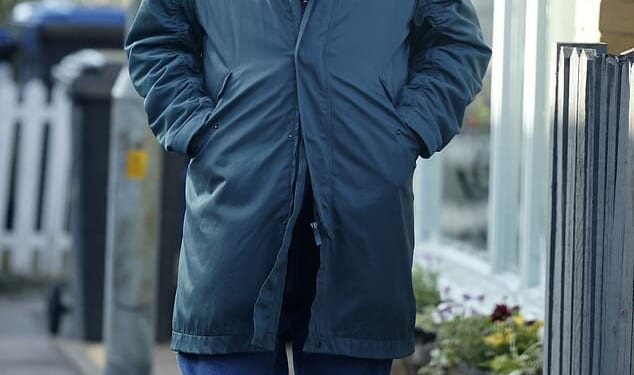 Soap legend looked unrecognisable 30 years on from his last iconic TV role with his groomed bushy beard as he strolled down the streets of Essex on Tuesday