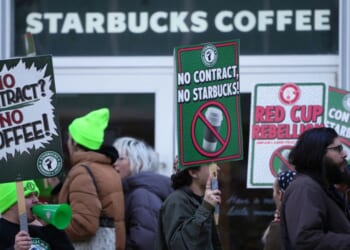 Protesters picket outside a Starbucks, Thursday in Philadelphia.
