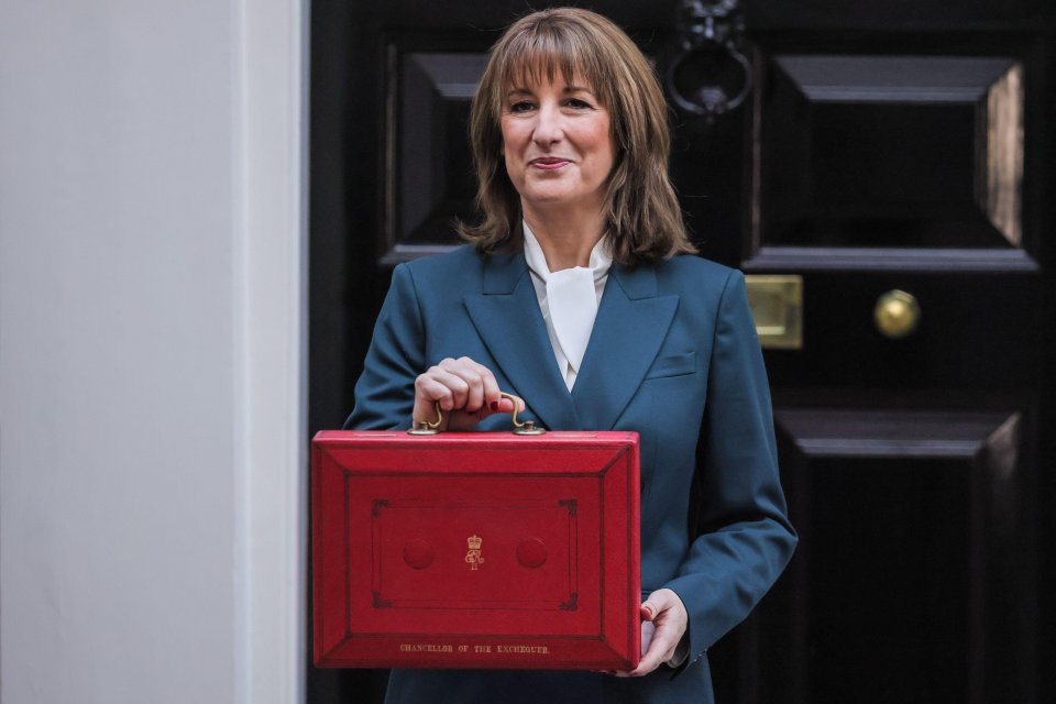 Rachel Reeves, Chancellor of the Exchequer, holding the red 'budget box'.