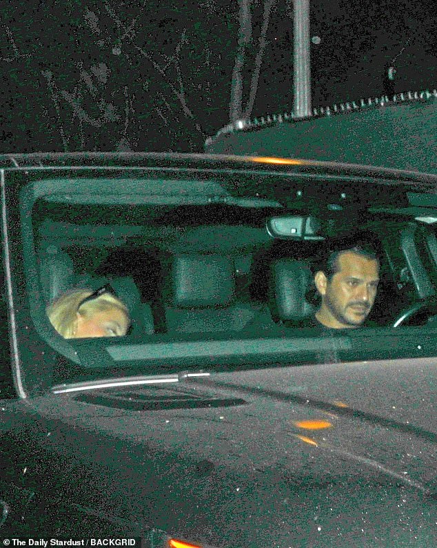 Photographs also captured the two-time Emmy nominee ducking down in the passenger seat next to Davino