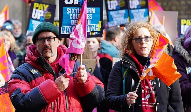 Members of the National Education Union (NEU) are pictured holding a rally outside the Department for Education (DfE) in London during strike action in November 2024