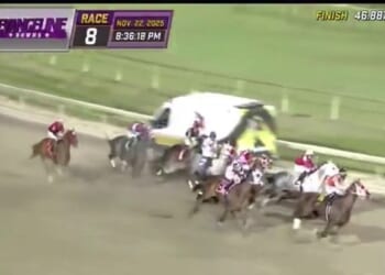 Eight jockeys had to dramatically swerve to avoid a head-on collision with an ambulance in a moment dubbed the most terrifying near miss in racing history on Saturday night