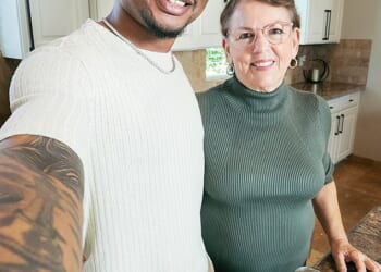 Wanda Dench, 68, and Jamal Hinton, 26, became unlikely friends in 2016 after a mistaken Thanksgiving text. They are pictured together ahead of Thanksgiving 2025
