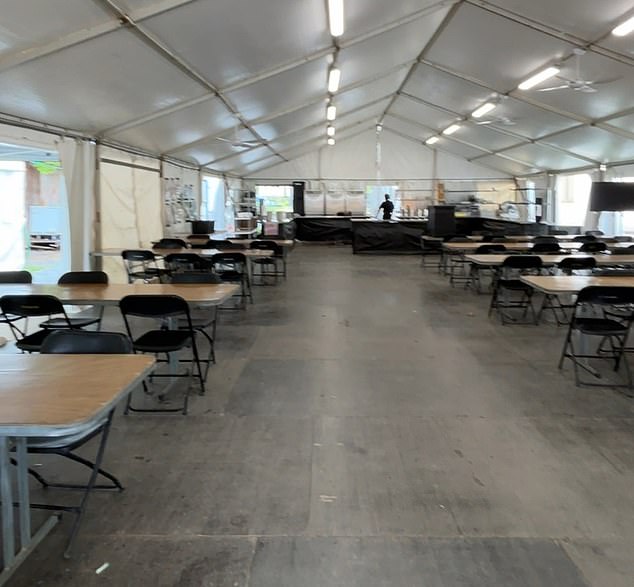 Crew congregate in the dining hall lined with rows of trestle tables where breakfast, lunch, and dinner are served, and, I am told, the food is ¿delicious¿ a far cry from the plain rice and beans the celebrities are living off less than a mile away