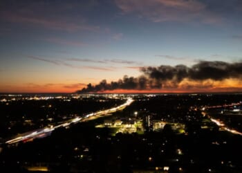 Smoke rises from the site of a UPS cargo plane crash near the UPS Worldport at Louisville Muhammad Ali International Airport in Louisville, Kentucky, on Nov. 4, 2025.