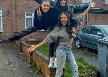 Emma Grede (centre) pictured with two of her sisters outside the humble 1970's terraced house in Plaistow, east London, where she grew up before finding fame and fortune