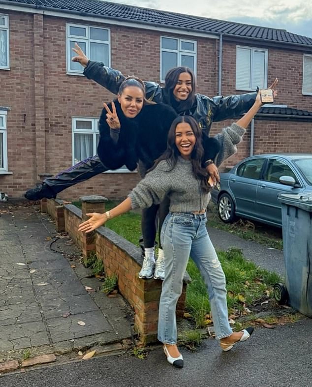 Emma Grede (centre) pictured with two of her sisters outside the humble 1970's terraced house in Plaistow, east London, where she grew up before finding fame and fortune