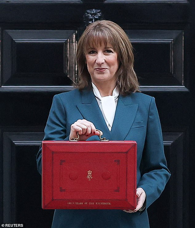Britain is facing a new 'brain drain' that threatens to add to the pain of Rachel Reeves' disastrous Budget. Pictured: British Chancellor of the Exchequer Rachel Reeves poses with the red budget box outside 11 Downing Street in London, Britain, November 26, 2025