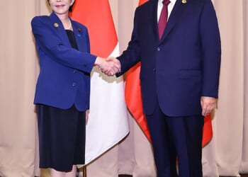 Japan's new prime minister Sanae Takiachi seen shaking hands with China's Xi Jinping - weeks after this photograph was taken, the two find themselves embroiled in a bitter war of words