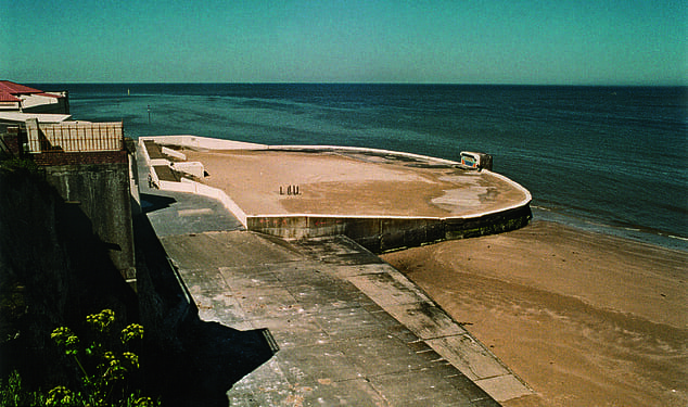 Margate Lido in Kent, pictured in 2004 after it had been filled in with sand following its closure about two decades before. It was one of many lidos which fell into decline after spending cuts