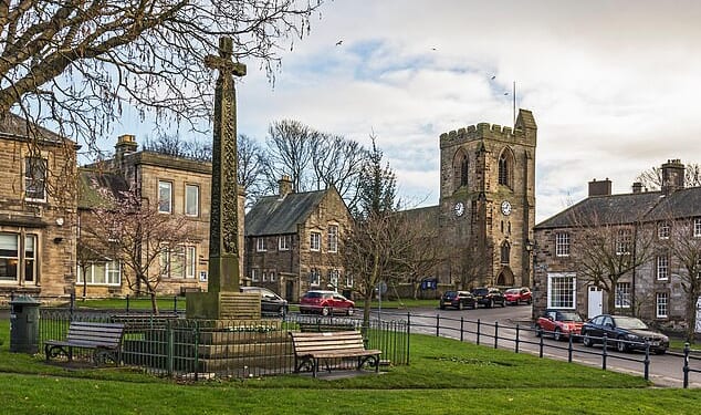The chocolate box market town of Rothbury (pictured) is lined with sandy brick cottages and quaint shops