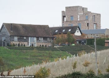 The 'brutalist' structure, (pictured) made of recycled bricks with a square-shaped tower, has been compared to a 'prison' and a 'multi-storey carpark'