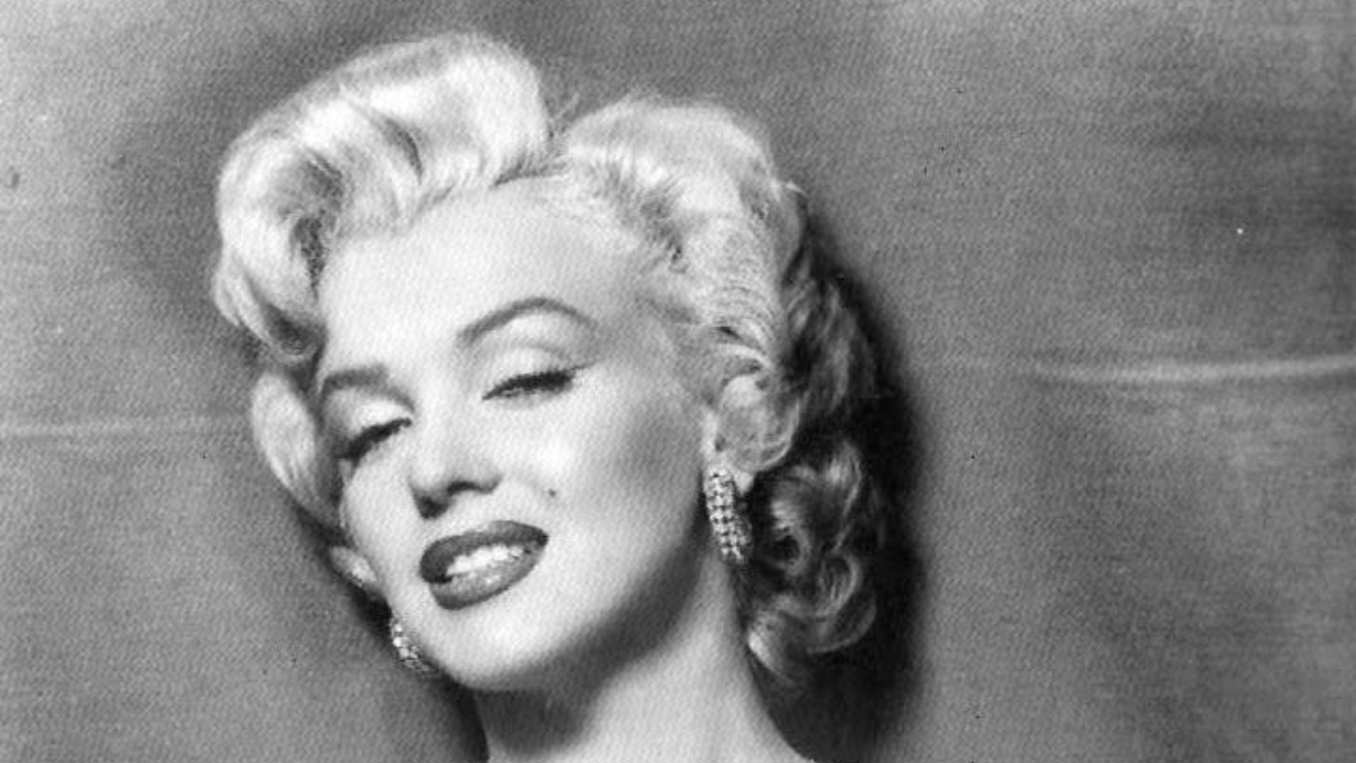 Marilyn Monroe looking upwards to the right.